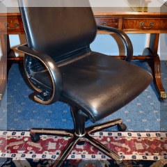 F56. Leatherette rolling desk chair 40”h x 24”w x 27”d - $50